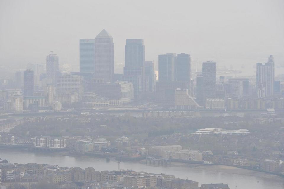 Pollution: thick smog hangs over London's Docklands (Nick Ansell/PA)