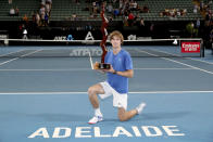 Russia's Andrey Rublev poses with the trophy after winning the Adelaide International tennis final match in Adelaide, Saturday, Jan. 18, 2020. (AP Photo/James Elsby)