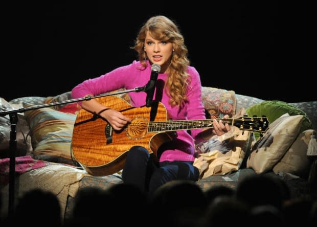 <p> Taylor Swift leans into her signature cozy fall vibes during her performance of "Ours" at the <a href="https://parade.com/entertainment/cma-awards-2022/" rel="nofollow noopener" target="_blank" data-ylk="slk:CMA Awards;elm:context_link;itc:0;sec:content-canvas" class="link ">CMA Awards</a> on Nov. 9, 2011.</p><p>Rick Diamond/Getty Images</p>