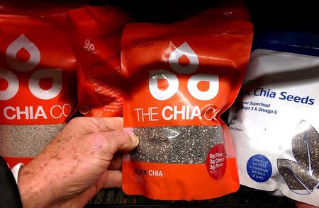 A customer holds chia seeds from the Chia Co company, owned by Australian farmer John Foss, at a suburban supermarket in Sydney, Australia, July 7, 2015. REUTERS/David Gray