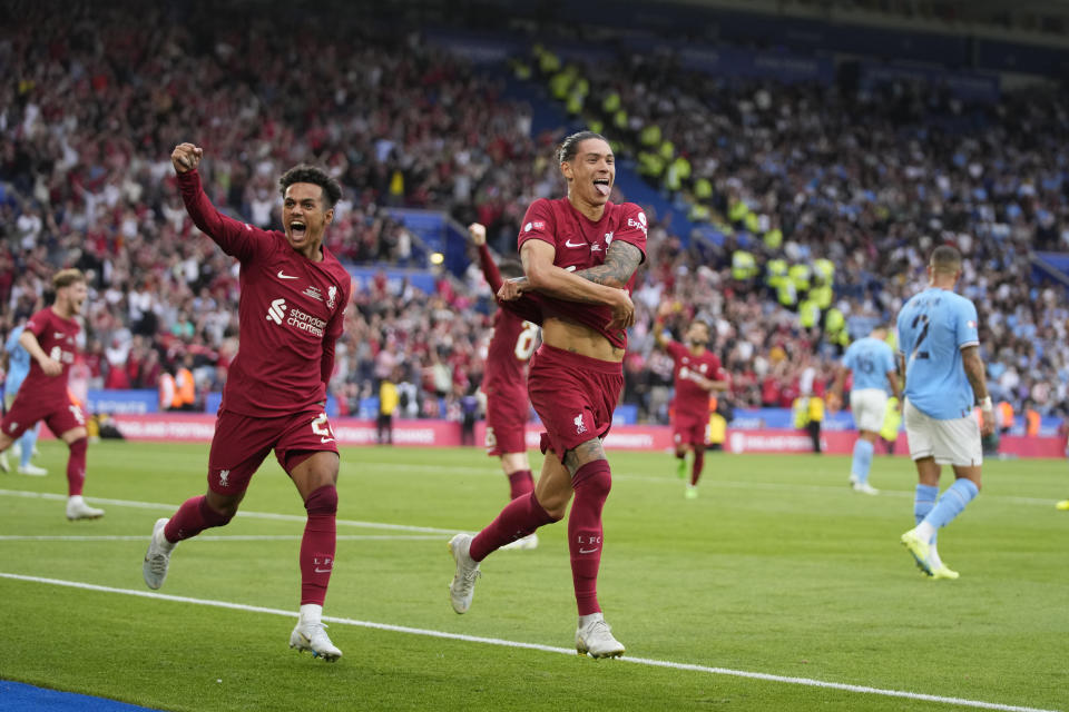 Liverpool's Darwin Nunez, right, celebrates after scoring his side's third goal during the FA Community Shield soccer match between Liverpool and Manchester City at the King Power Stadium in Leicester, England, Saturday, July 30, 2022. (AP Photo/Frank Augstein)