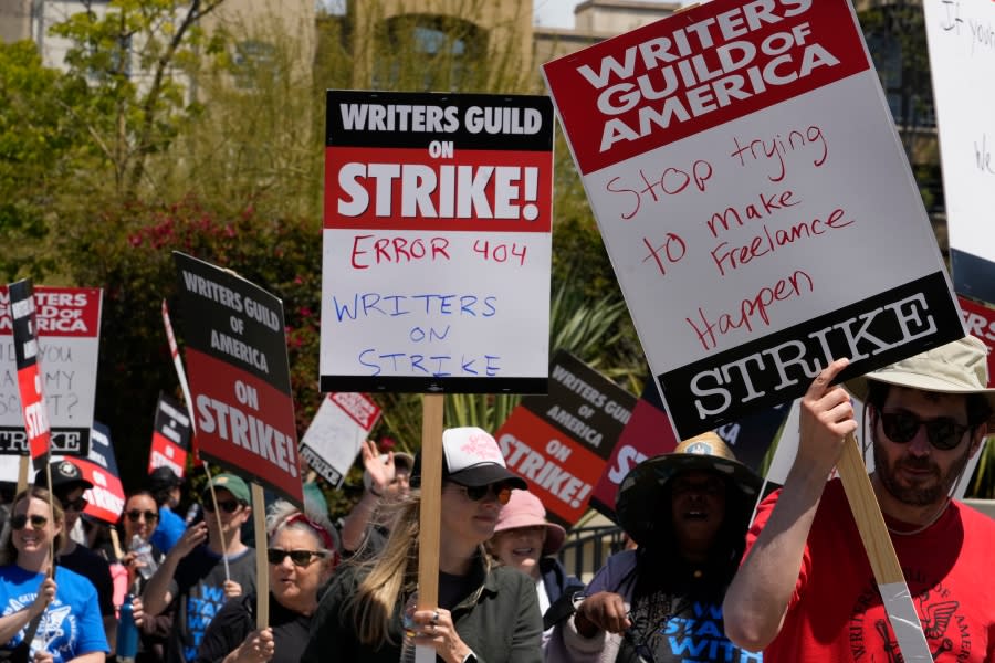 Members of the Writers Guild of America, WGA picket outside CBS Television City in the Fairfax District of Los Angeles Tuesday, May 2, 2023. The first Hollywood strike in 15 years began Tuesday as the economic pressures of the streaming era prompted unionized TV and film writers to picket for better pay outside major studios, a work stoppage that already is leading most late-night shows to air reruns. (AP Photo/Damian Dovarganes)