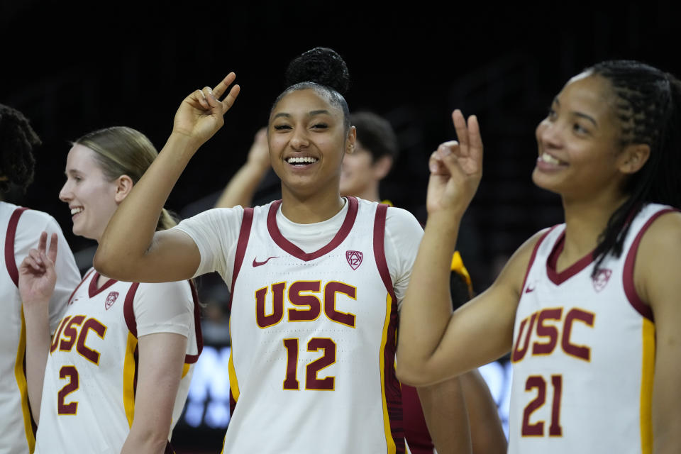 Southern California guard JuJu Watkins (12) celebrates after a 93-42 win against Le Moyne in an NCAA college basketball game in Los Angeles, Monday, Nov. 13, 2023. (AP Photo/Ashley Landis)