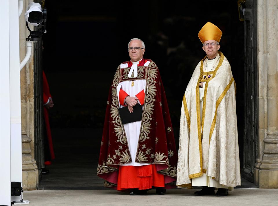 Dean of Westminster David Hoyle and Archbishop of Canterbury Justin Welby await the arrival of Britain's King Charles III and Camilla, Queen Consort, at Westminster Abbey for their coronation ceremony in London on May 6.