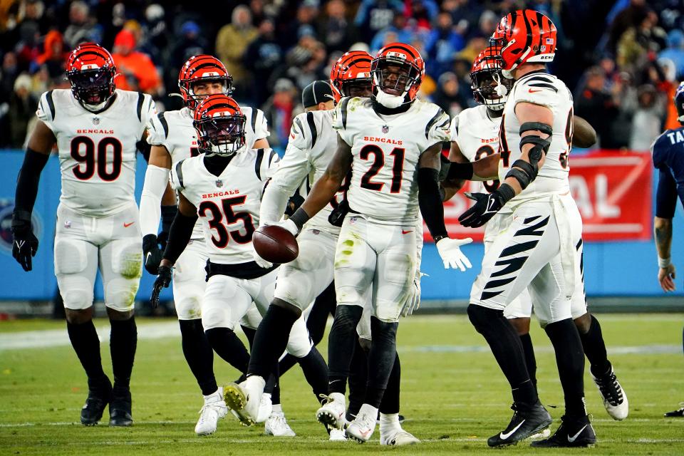 Cincinnati Bengals cornerback Mike Hilton (21) celebrates an interception with the Cincinnati Bengals defense in the third quarter during an NFL divisional playoff football game, Saturday, Jan. 22, 2022, at Nissan Stadium in Nashville. The Cincinnati Bengals defeated the Tennessee Titans, 19-16, to advance to the AFC Championship game. 