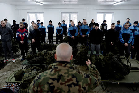 A commander instructs recruits as they gather at a barrack on their first day of 16-day basic training for Poland's Territorial Defence Forces, at a military unit in Siedlce, Poland, December 1, 2017. REUTERS/Kacper Pempel/Files