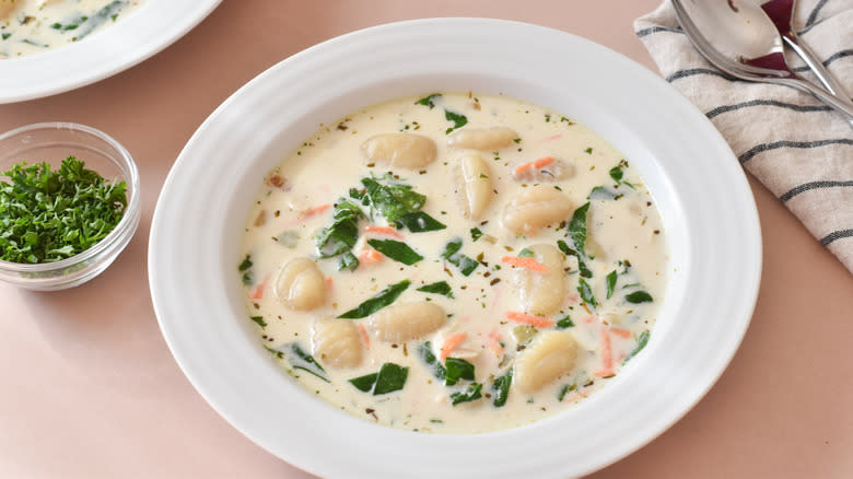 creamy chicken and gnocchi soup in white bowl