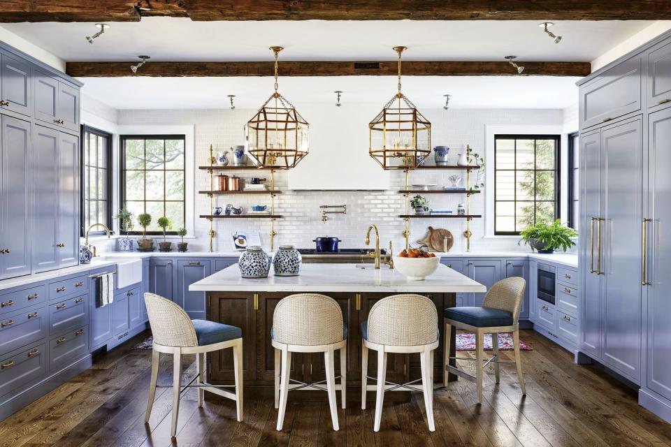 a kitchen with a bar and chairs