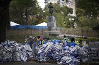 Volunteers pile space blanket warming sheets for finishing runners past the finish line shortly before the start of the 2014 New York City Marathon in Central Park in Manhattan, November 2, 2014 REUTERS/Mike Segar (UNITED STATES - Tags: SPORT ATHLETICS)