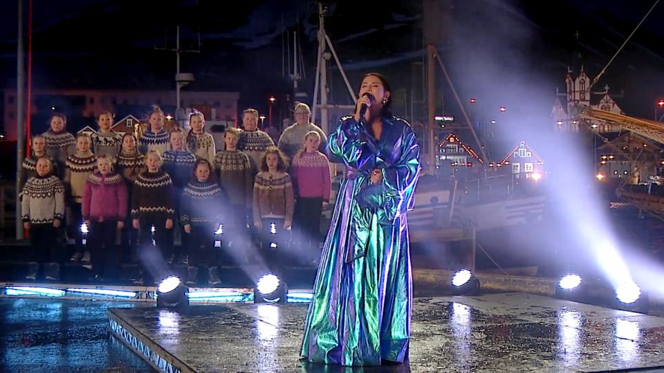 Molly Sandén performs "Husavik" with a choir of sweater-clad kids in Iceland for the Oscar night pre-show.