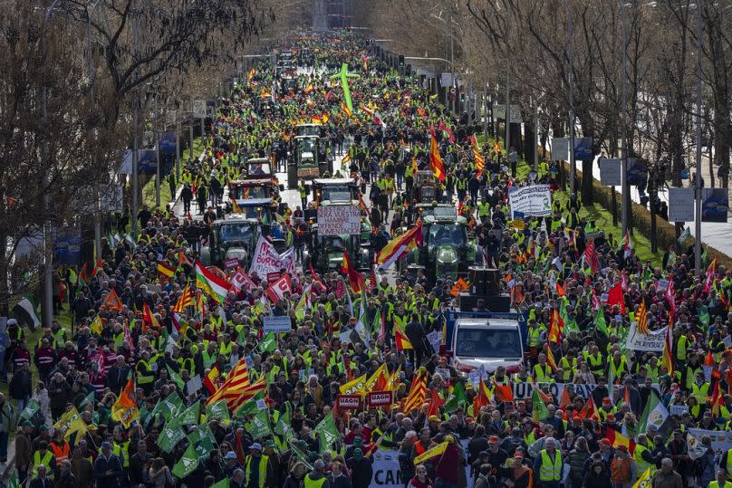 Farmers rally towards the European Parliament offices in Madrid, Spain, Monday, Feb. 26, 2024.