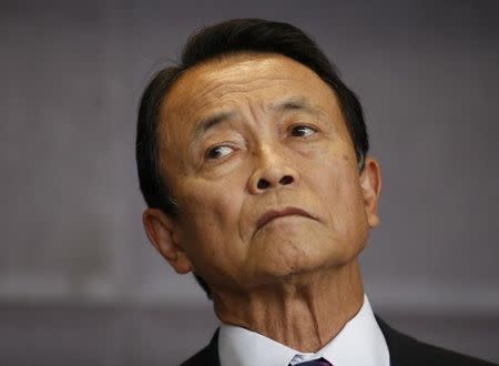 Japan's Finance Minister Taro Aso attends a news conference in Beijing October 22, 2014. REUTERS/Kim Kyung-Hoon