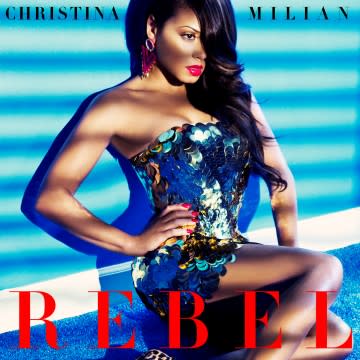 It’s here! It’s here! <strong> Christina Milian</strong> is showing off her rebellious side in the sultry (and highly-anticipated) music video for her hot new single, “Rebel,” and ETonline has the video exclusively in the player below. The video features Christina engulfed in an over-sized, dreamy parachute in several scenes and it perfectly encompasses the steamy sound and lyrics of the tune, which the 33-year-old singer confirms is inspired by her relationship with Lil Wayne. “It’s safe to say it is about the man in my life, yes,” Christina tells ETonline. “There’s nothing better than that feeling of new chemistry when you’re so into someone and you could care less about what anyone else thinks… and there’s butterflies! It’s a real feeling that people experience.” How cute! So, what does it mean to be a “rebel” for someone? <strong>VIDEO:</strong> Christina Milian Accidentally Admits She "Loves" Lil Wayne! “For me, I’m so inspired by the relationship that I’m in that it’s definitely an experience. It’s that careless, hopeless, romantic love – that feeling of ‘I will do anything for you’ and it’s just incredible and so yea, ‘rebel for you’ means ‘I’m all about you.’ We love that! Last month, Christina accidentally let it slip that she “loved” the 32-year-old rapper during a radio interview(link), but she couldn't stop gushing about her man to ETonline, proudly admitting how much the Cash Money Entertainment CEO means to her. “He’s very special to me, yeah,” she answered when asked if the couple is in love. Splash News As for whether or not she sees wedding bells in their future, well, she was a little more coy about that. “You never know, I mean, love does inspire beautiful things like that,” she shared. “I don’t put too much pressure on one thing but I’m just living freely with him and we’re both very happy. I feel like if you don’t put too much expectations and too much high-hopes into things then everything will fall into place.” <strong>RELATED:</strong> Is Lil Wayne The Coolest Dad Ever? The pair has been linked since July, but for the most part have kept the relationship relatively quiet. And while we don’t know if we’ll be seeing them walking down the aisle, the Turned Up! starlet says Wayne will appear on her upcoming five-song EP, her first album in nearly a decade. “Wayne for sure, yes,” she confirmed. “Actually, he just texted me yesterday and said he’s going to be on one of the songs on the EP.” <strong>RELATED: </strong>Christina Milian is Hilariously Honest on Her Reality Show Christina reveals he’ll be on a song called “Do It,” which she notes has a “cool, laid-back house party feel to it… circa '90s Janet Jackson." Another rapper she’d love to see contribute to the EP? Label-mate Drake. We won’t have to wait long to hear the sure-to-be catchy tracks -- her EP is scheduled for release this June! 2015 is proving to be a huge year for Christina. In addition to the release of her EP, her E! reality show, <em>Christina Milian Turned Up</em> has been renewed for a second season. The stylish star is also opening a clothing store in Los Angeles this summer for her clothing line, We Are Pop Culture. <strong> How much are you loving Christina’s “Rebel” music video? And, are you excited to hear her new collab with Lil Wayne? </strong>