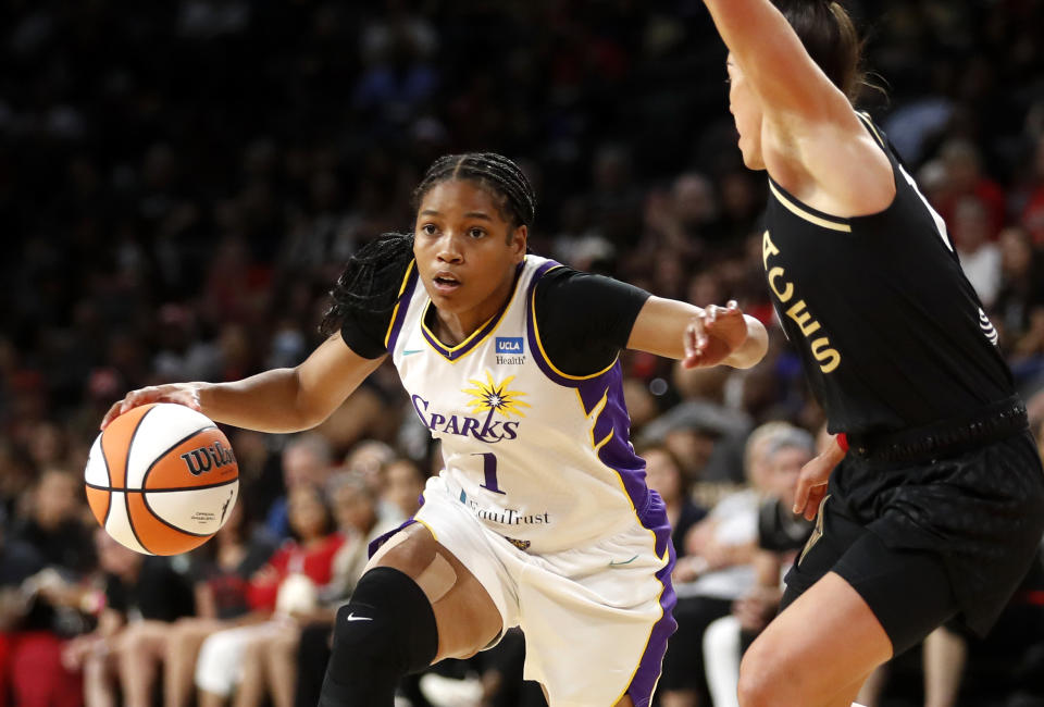 Los Angeles Sparks guard Zia Cooke drives past Las Vegas Aces guard Kelsey Plum during the first quarter of their game on May 27, 2023, at Michelob ULTRA Arena in Las Vegas. (Steve Marcus/Getty Images)