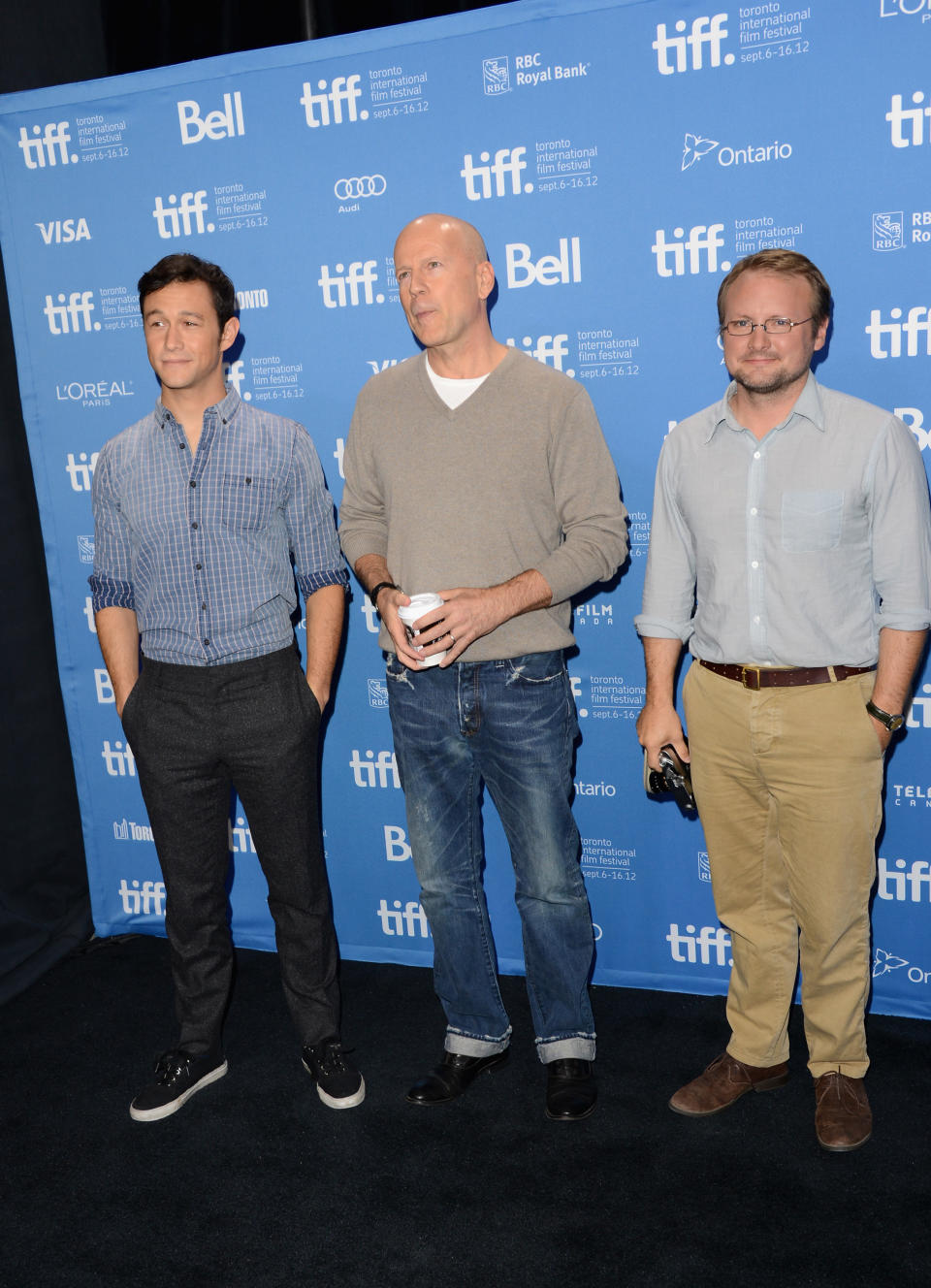 TORONTO, ON - SEPTEMBER 06: (L-R) Actor/Producer Joseph Gordon-Levitt, actor Bruce Willis and Writer/Director Rian Johnson pose at the "Looper" photo call during the 2012 Toronto International Film Festival at TIFF Bell Lightbox on September 6, 2012 in Toronto, Canada. (Photo by Jason Merritt/Getty Images)