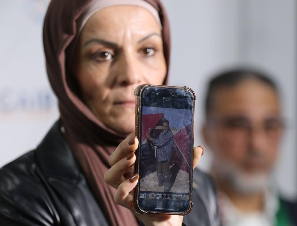 Newark, NJ -- February 15, 2024 -- Najla Khass holds a photo of her uncle who lives in Gaza. The picture she’s holding up is her uncle who has been displaced and is living in a tent in Rafah. She and others who are concerned for relatives in Gaza took part in a press conference held by CAIR at their office in Newark.