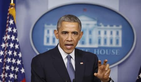 U.S. President Barack Obama answers a question about the cyberattack on Sony Pictures after his end of the year press conference in the briefing room of the White House in Washington December 19, 2014. REUTERS/Larry Downing