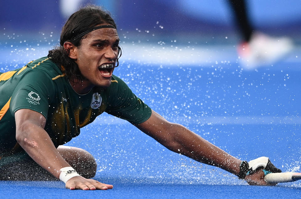 <p>South Africa's Mustaphaa Cassiem reacts during the men's pool B match of the Tokyo 2020 Olympic Games field hockey competition against Canada, at the Oi Hockey Stadium in Tokyo on July 30, 2021. (Photo by MARTIN BUREAU / AFP) (Photo by MARTIN BUREAU/AFP via Getty Images)</p> 