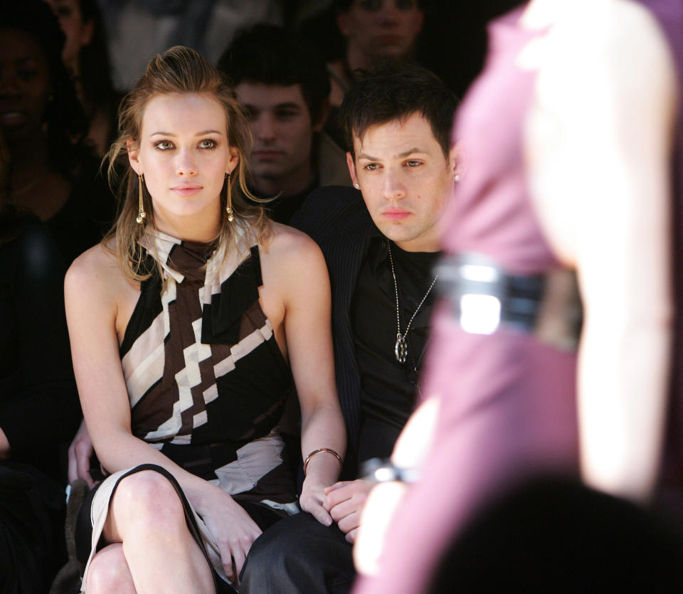 hilary sitting at a fashion show