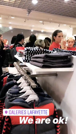 People take shelter in Galeries Lafayette after gunshots were heard in Strasbourg, France, December 11, 2018 in this still image from video obtained from social media. Elizabeth Osterwisch/via REUTERS