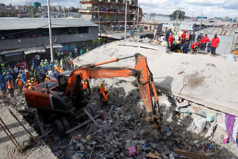 Rescue teams search the scene where a building collapsed in Nairobi