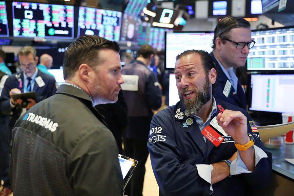 Traders work on the floor of the New York Stock Exchange shortly after the opening bell in New York, U.S., July 12, 2019. REUTERS/Lucas Jackson