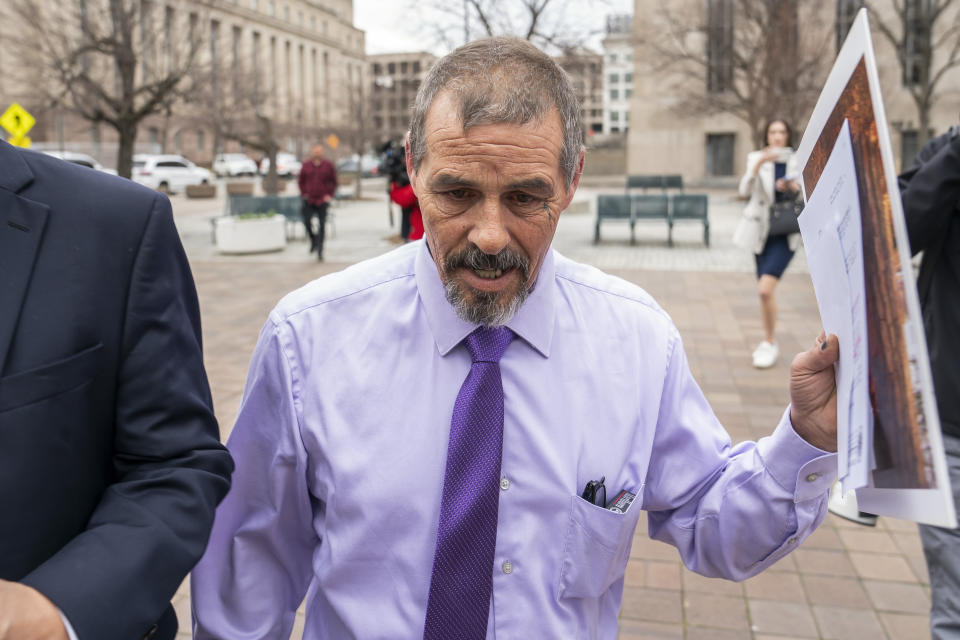 Kevin Seefried, a Delaware man who stormed the Capitol with Confederate battle flag, departs Federal Court after sentencing, Thursday, Feb. 9, 2023, in Washington. Seefried, who threatened a Black police officer with a pole attached to a Confederate battle flag as he stormed the U.S. Capitol on Jan. 6, 2021, has been sentenced to three years in prison. (AP Photo/Nathan Howard)