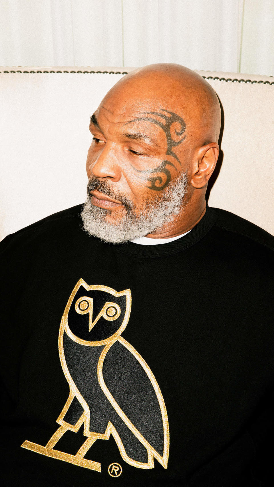 Mike Tyson wearing OVO owl sweater