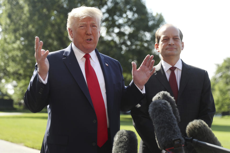 President Trump speaks to members of the media with Secretary of Labor Alex Acosta on the South Lawn of the White House in Washington, D.C., Friday. (Photo: Andrew Harnik/AP)