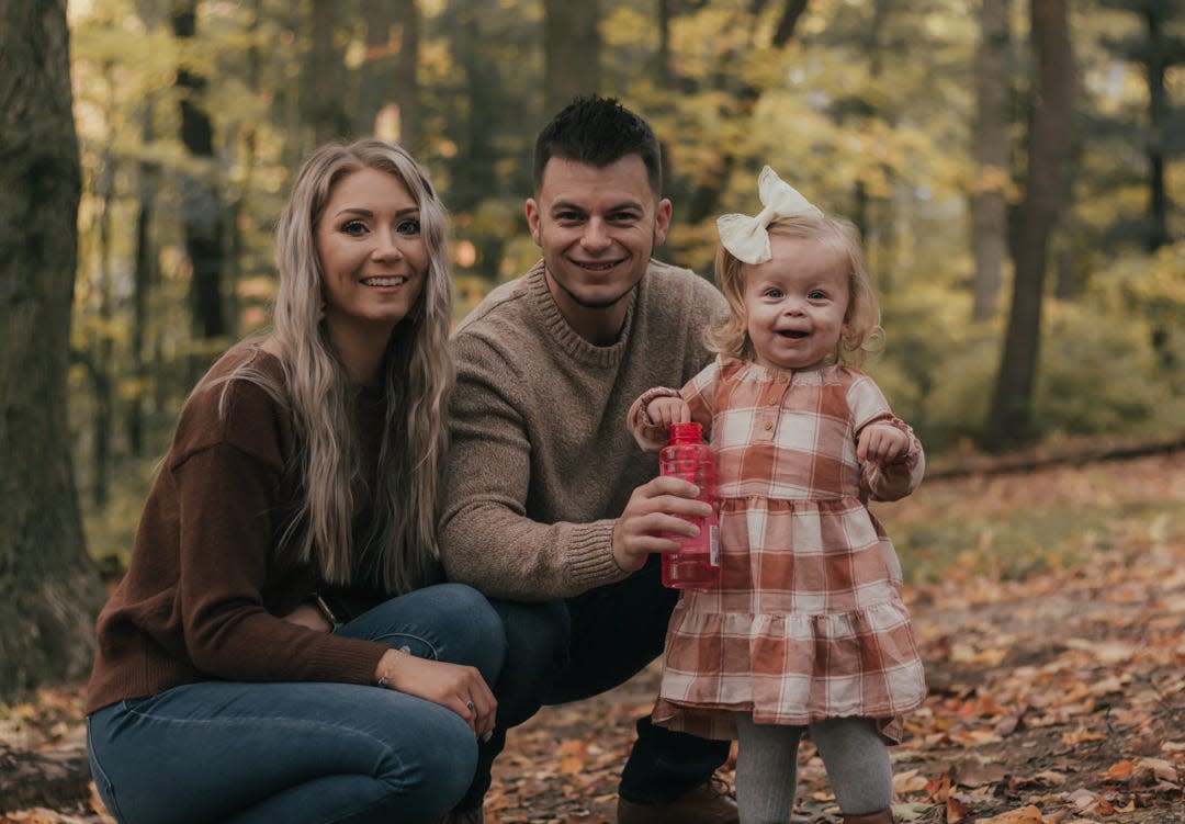 Kendra Ireland (left), Cody Ireland and their daughter, Hudson, have returned home from the hospital after father and daughter took part in a kidney transplant.