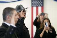 Deported veterans Leonel Contreras, center, and Mauricio Hernandez Mata, left, are sworn in as U.S. citizens at a special naturalization ceremony Wednesday, Feb. 8, 2023, in San Diego. The two U.S. Army veterans who were deported to Mexico a decade ago won their long battle to return to the United States and become U.S. citizens. (AP Photo/Gregory Bull)