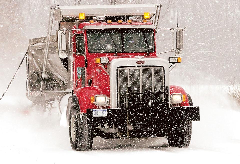 A St. Joseph County Road Commission truck plows a road after a snowstorm in 2018.