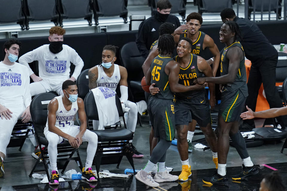 Baylor's Mark Vital (11) celebrates with teammates after a play against Washington during the second half of an NCAA college basketball game Sunday, Nov. 29, 2020, in Las Vegas. (AP Photo/John Locher)