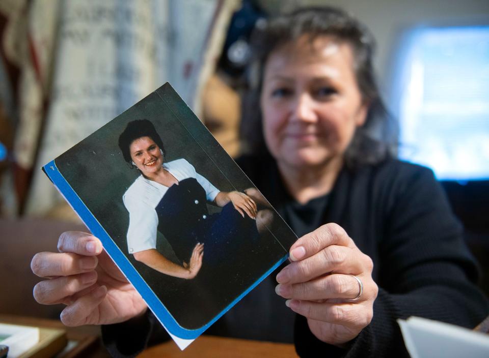 Tina Leake shows off a photo of her sister, Sherri Malarik, on Wednesday, Oct. 18, 2023. Malarik was killed nearly 20 years ago, and her former husband, Gregory Malarik, was acquitted of her murder during a trial last week.