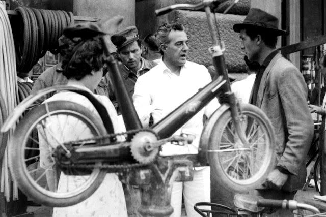 <p>Everett</p> Vittorio De Sica and Lamberto Maggiorani on the set of 'Bicycle Thieves'
