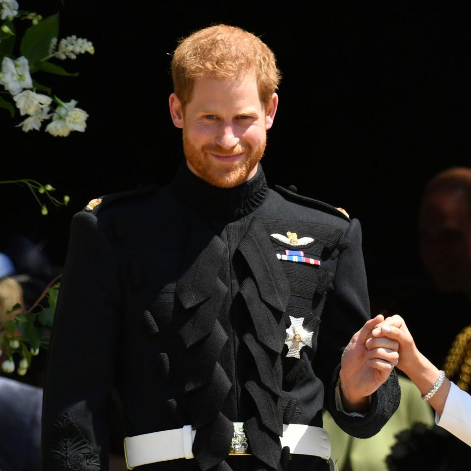 At his royal nuptials, Prince Harry's scruff was a break from tradition per longstanding rules in Britain's military.