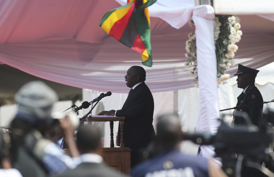 South African President Cyril Ramaphosa delivers his speech during the funeral ceremony of the late former Zimbabwean leader, Robert Mugabe at the National Sports stadium in Harare, Saturday,Sept, 14, 2019. African heads of state and envoys are gathering to attend a state funeral for Mugabe, whose burial has been delayed for at least a month until a special mausoleum can be built for his remains. (AP Photo/Tsvangirayi Mukwazhi)