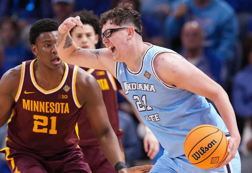 Indiana State center Robbie Avila, here driving past a defender in Sunday's victory over Minnesota, heads the list of all five Sycamore starters averaging in double figures with a team-high 17.1 points per game.