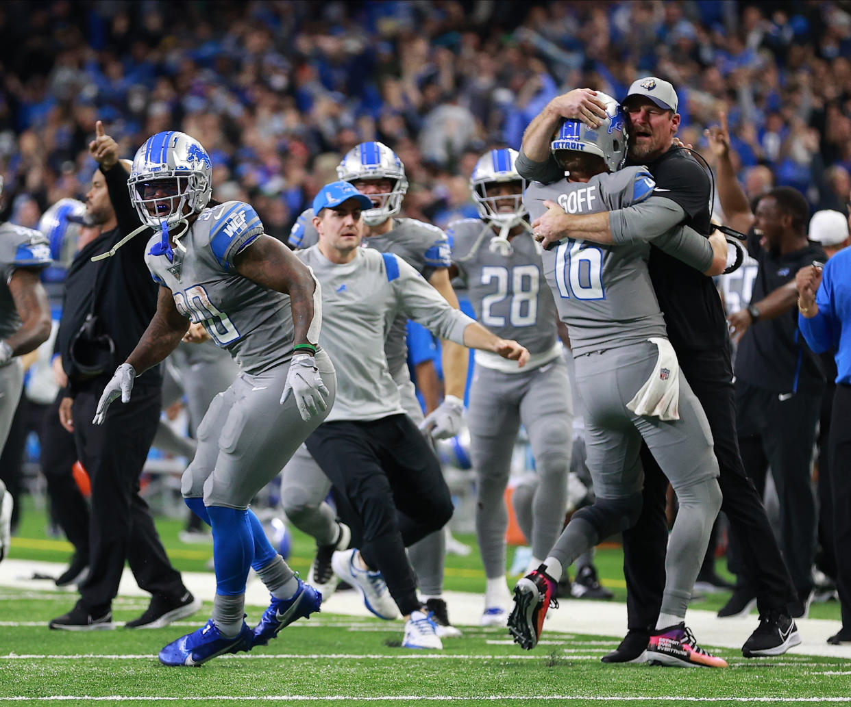 Lions quarterback Jared Goff celebrates with head coach Dan Campbell after beating the Vikings last season. (Photo by Rey Del Rio/Getty Images)