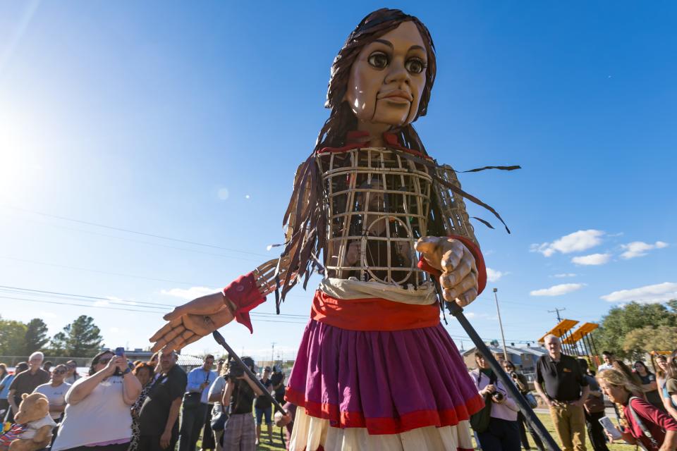 Little Amal, the 12-foot puppet of a ten-year-old Syrian child, is welcomed at her first stop in El Paso at Armijo Park in Segundo Barrio on Wednesday, Oct. 25, 2023.