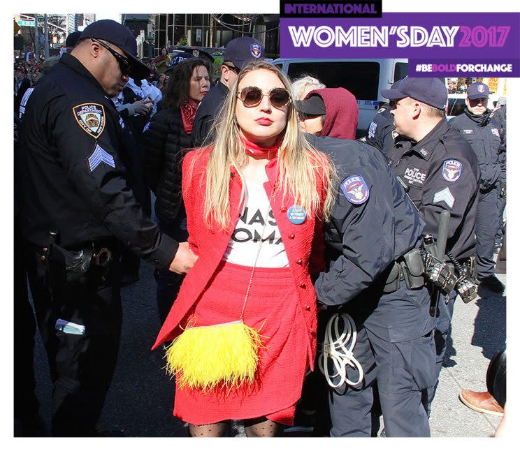 An unidentified woman protester wearing a Nasty Woman T-shirt was arrested by New York Police on Wednesday.