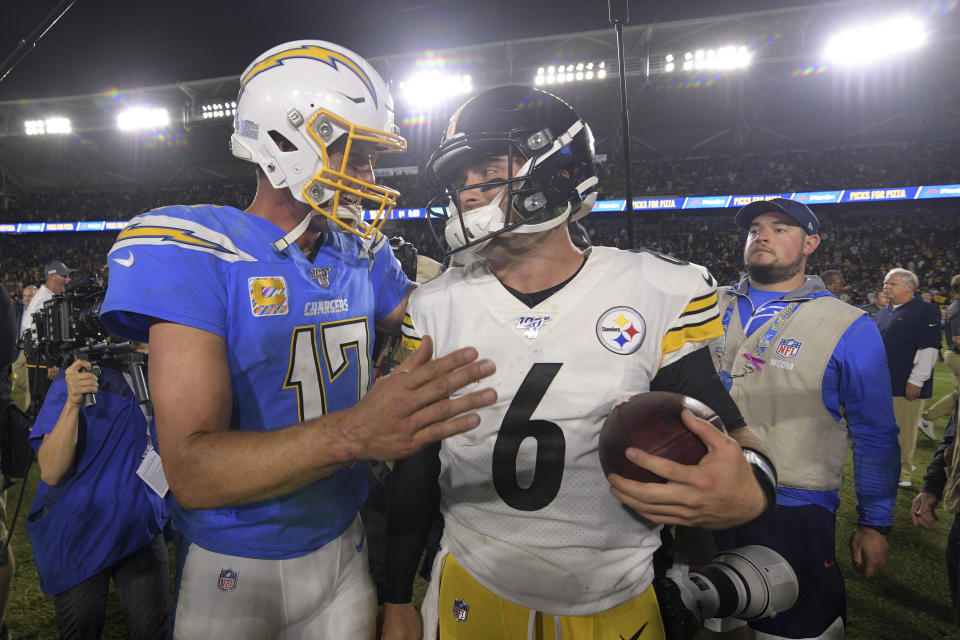 Los Angeles Chargers quarterback Philip Rivers, left, and Pittsburgh Steelers quarterback Devlin Hodges greet each other after an NFL football game, Sunday, Oct. 13, 2019, in Carson, Calif. (AP Photo/Kyusung Gong)