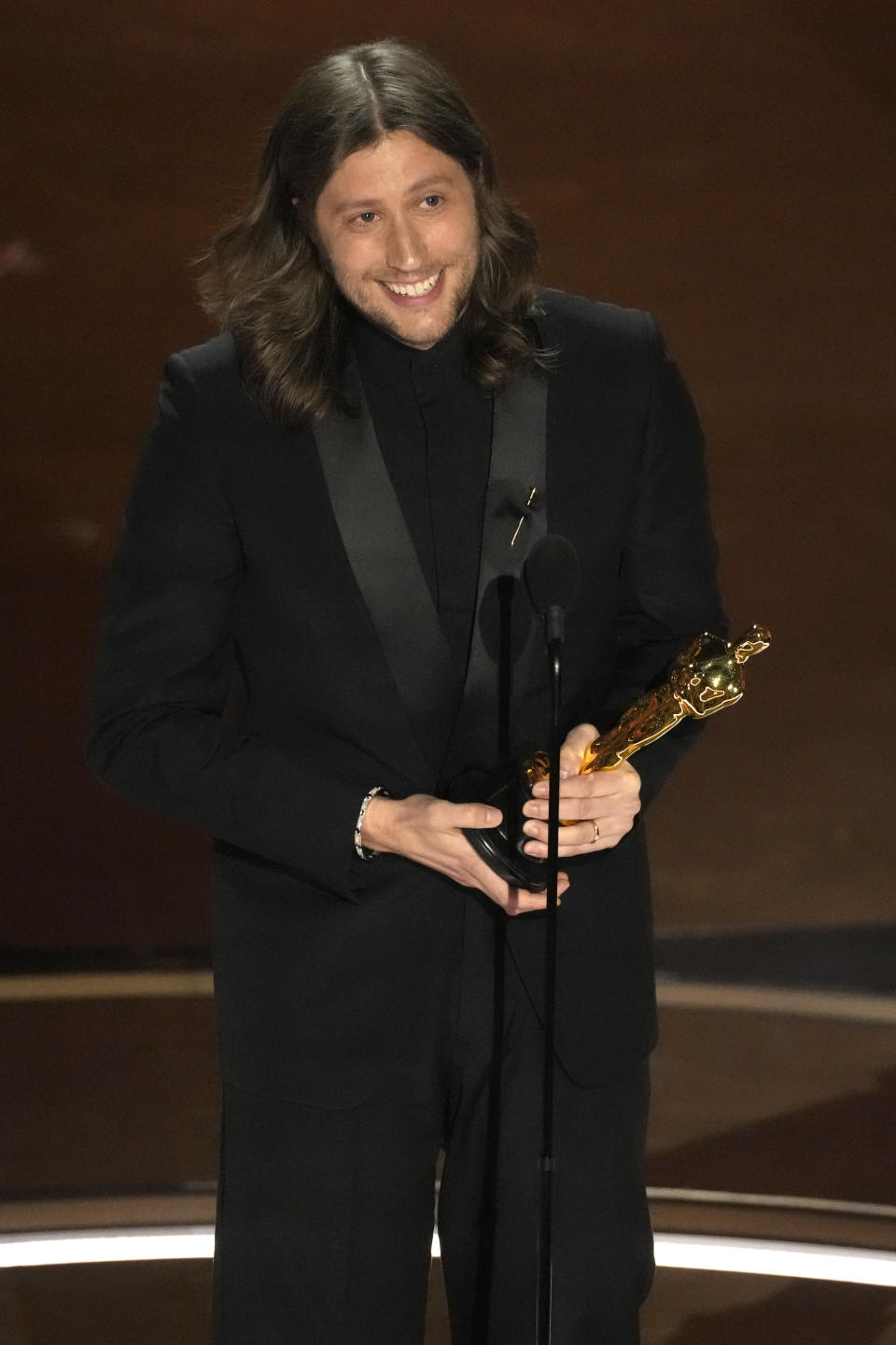 Ludwig Goransson accepts the award for best original score for "Oppenheimer" during the Oscars on Sunday, March 10, 2024, at the Dolby Theatre in Los Angeles. (AP Photo/Chris Pizzello)