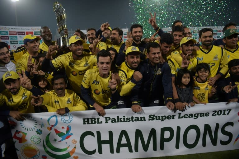 Cricketers of Peshawar Zalmi their victory over Quetta Gladiators in the final cricket match of the Pakistan Super League (PSL) at The Gaddafi Cricket Stadium in Lahore on March 5, 2017