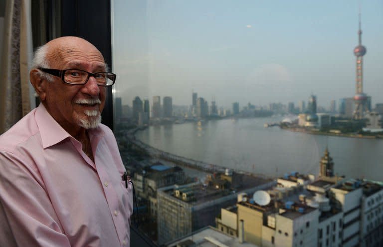 Gary Matzdorff talks to AFP in his hotel room as he looks out at the Pudong area of Shanghai on May 28, 2013. Matzdorff returned to his former home in Shanghai hoping to find the Chinese woman he spotted across a dance hall floor 70 years ago