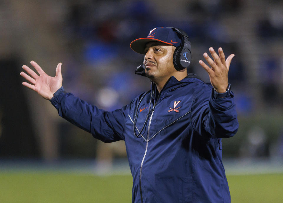 Virginia coach Tony Elliott reacts to a call on the field during the first half of the team's NCAA college football game against Duke in Durham, N.C., Saturday, Oct. 1, 2022. (AP Photo/Ben McKeown)