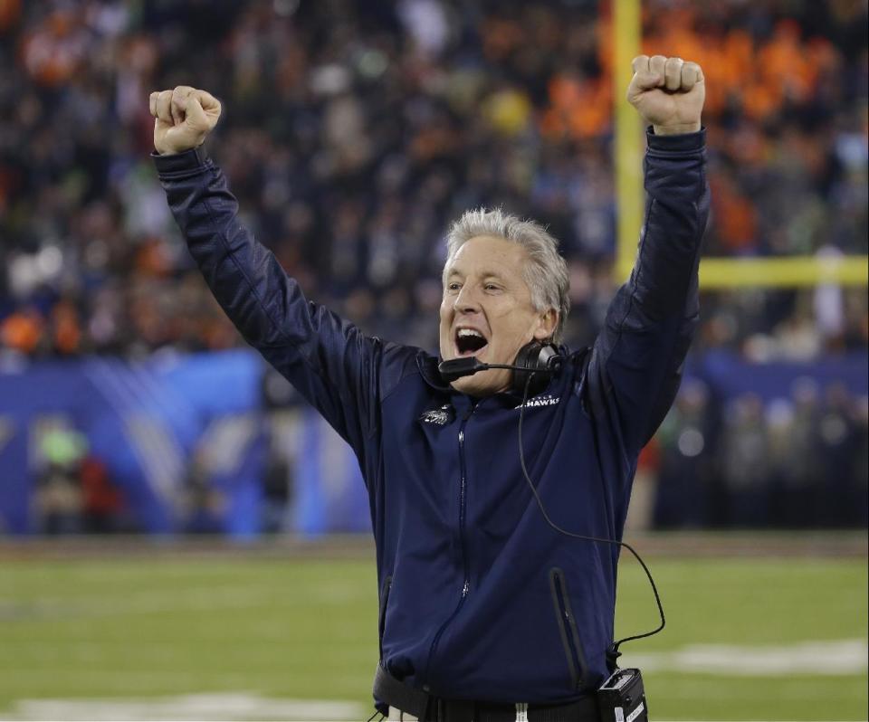 Seattle Seahawks head coach Pete Carroll reacts as Percy Harvin returns a kickoff for a touchdown during the second half of the NFL Super Bowl XLVIII football game against the Denver Broncos Sunday, Feb. 2, 2014, in East Rutherford, N.J. (AP Photo/Matt Slocum)