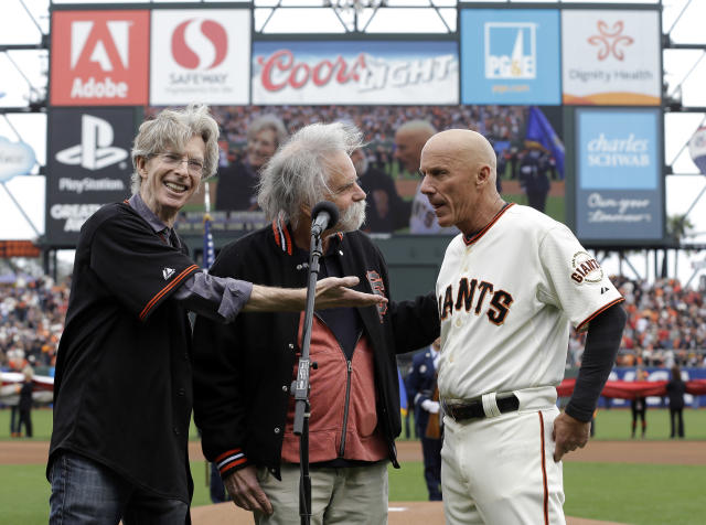 Tim Flannery (far right) joins the Grateful Dead&#39;s Phil Lesh, and Bob Weir for the national anthem. (AP)