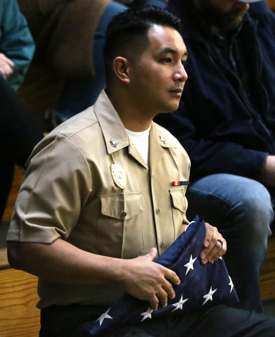 Navy Master-At-Arms Jason Ruiz is stationed at the Portsmouth Naval Shipyard and waits to participate in the flag ceremony at Marshwood Great Works Veterans Day assembly Thursday, Nov. 9, 2023.