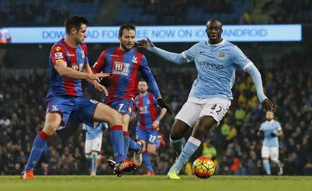 Football Soccer - Manchester City v Crystal Palace - Barclays Premier League - Etihad Stadium - 16/1/16 Manchester City's Yaya Toure in action with Crystal Palace's Scott Dann Action Images via Reuters / Jason Cairnduff Livepic